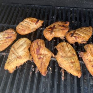 Sliced smoked chicken breast, fully cooked with golden smoked edge