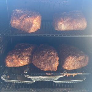 Smoked pulled pork, hand-pulled with visible bark and smoke ring